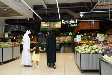 Emirati Family Shopping at Springfield Market Produce Section