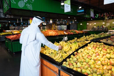 Emirati Man Shopping for Fresh Fruit in Supermarket