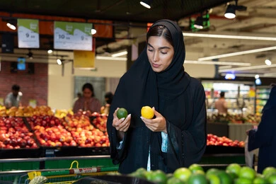 Emirati Woman Shopping for Fresh Produce in UAE Supermarket