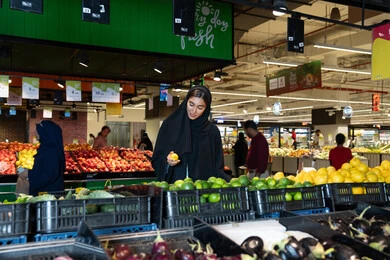 Emirati Woman Shopping for Fresh Produce in Supermarket