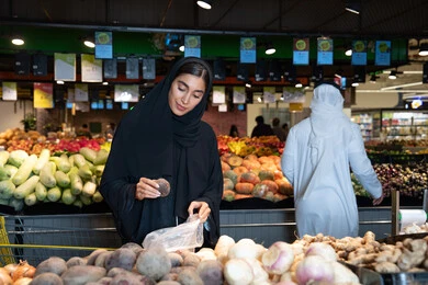 Emirati Woman Shopping for Vegetables in UAE Supermarket