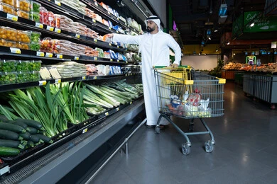 Emirati Man Shopping for Fresh Vegetables in Supermarket