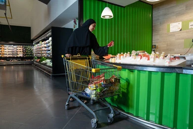 Emirati Woman Shopping at Modern Grocery Supermarket