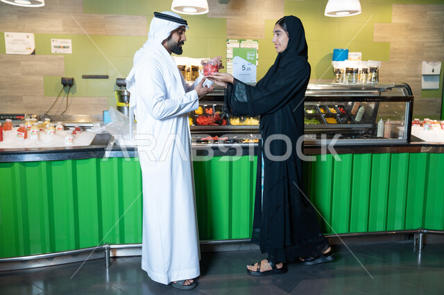 Emirati Man and Woman at a Fresh Juice Bar