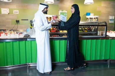 Emirati Man and Woman at a Fresh Juice Bar