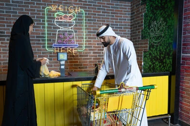 Emirati Couple Shopping at UAE Grocery Store