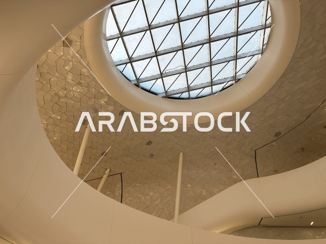 A distinctive architectural interior shot, October 5, 2025, a place for readers and lovers of science, books, and knowledge, the largest public library in Saudi Arabia, the King Abdulaziz Center for World Culture (Ithra) in Dhahran, Saudi Arabia, with books, novels, and stories arranged on the shelves.