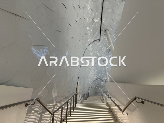 Architectural interior engineering designs, October 5, 2025, a place for readers and lovers of science, books, and knowledge, the largest public library in Saudi Arabia, King Abdulaziz Center for World Culture (Ithra) in Dhahran, Saudi Arabia, books, novels, and stories arranged on the shelves.