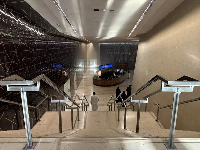 A man is using the stairs of the Ithra Center, October 5, 2025, a place for readers and lovers of knowledge, books, and learning, the largest public library in Saudi Arabia, the King Abdulaziz Center for World Culture (Ithra) in Dhahran, Saudi Arabia, with books, novels, and stories arranged on the shelves.