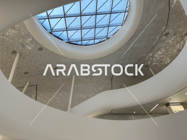 A distinctive architectural interior shot, October 5, 2025, a place for readers and lovers of science, books, and knowledge, the largest public library in Saudi Arabia, the King Abdulaziz Center for World Culture (Ithra) in Dhahran, Saudi Arabia, with books, novels, and stories arranged on the shelves.