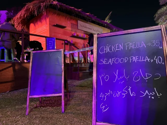 A price list at one of the restaurants during the Spain Street event at the King Abdulaziz Center for World Culture "Ithra" in Dhahran, Eastern Province, Saudi Arabia, on October 11, 2025, offers a cultural and entertainment experience, live musical and artistic performances, flamenco dances, interactive activities, family and children's suitable activities, and a vibrant festive atmosphere.