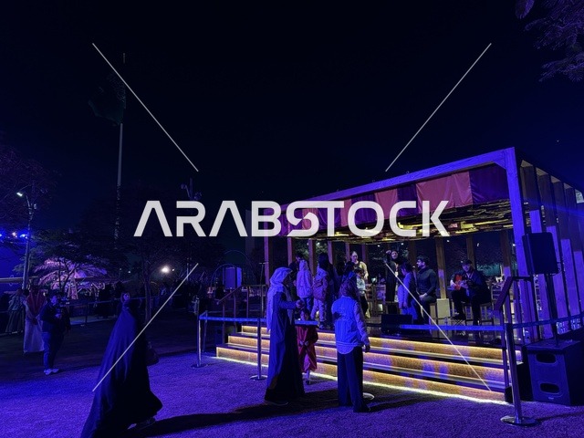 The children interacted with an artist presenting a musical performance at the Spain Street event at the King Abdulaziz Center for World Culture "Ithra" in Dhahran, Eastern Province, Saudi Arabia, on October 11, 2025. It was a cultural and entertainment experience featuring flamenco dances and interactive activities, Spanish-themed restaurants and cafes, family and children-friendly activities, and a vibrant festive atmosphere.