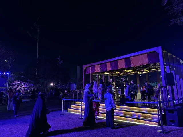 The children interacted with an artist presenting a musical performance at the Spain Street event at the King Abdulaziz Center for World Culture "Ithra" in Dhahran, Eastern Province, Saudi Arabia, on October 11, 2025. It was a cultural and entertainment experience featuring flamenco dances and interactive activities, Spanish-themed restaurants and cafes, family and children-friendly activities, and a vibrant festive atmosphere.