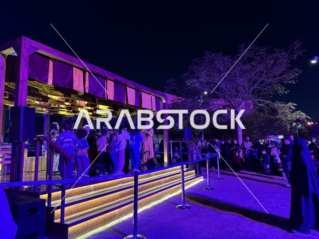 The children interacted with an artist presenting a musical performance at the Spain Street event at the King Abdulaziz Center for World Culture "Ithra" in Dhahran, Eastern Province, Saudi Arabia, on October 11, 2025. It was a cultural and entertainment experience featuring flamenco dances and interactive activities, Spanish-themed restaurants and cafes, family and children-friendly activities, and a vibrant festive atmosphere.
