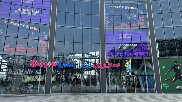 The Sufori Land brand at the U Walk complex in Jeddah, Saudi Arabia, February 15, 2024, features an open walkway with a modern design, international and local restaurants and cafes, a comprehensive urban destination for walking, entertainment, and shopping, outdoor seating and social spaces, and a vibrant family and youth atmosphere.