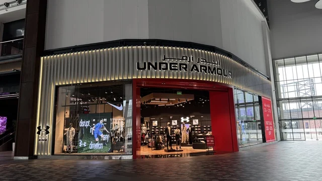 Stores for brands at the U Walk complex in Jeddah, Saudi Arabia, February 15, 2024, an open walkway with a modern design, international and local restaurants and cafes, a complete urban destination for walking, entertainment, and shopping, outdoor seating and social spaces, a vibrant family and youth atmosphere.