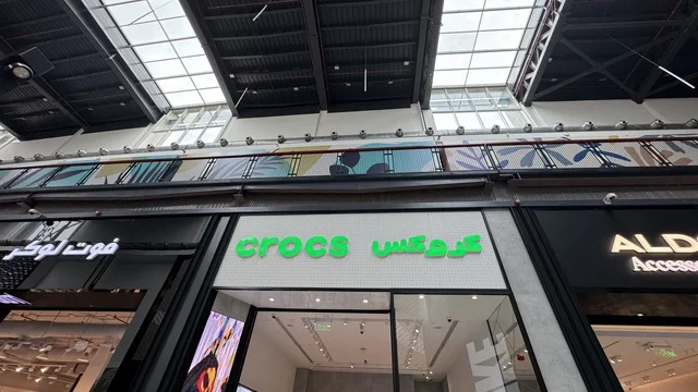 Stores for brands at the U Walk complex in Jeddah, Saudi Arabia, February 15, 2024, an open walkway with a modern design, international and local restaurants and cafes, a complete urban destination for walking, entertainment, and shopping, outdoor seating and social spaces, a vibrant family and youth atmosphere.