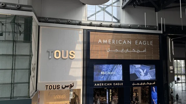 Stores for brands at the U Walk complex in Jeddah, Saudi Arabia, February 15, 2024, an open walkway with a modern design, international and local restaurants and cafes, a complete urban destination for walking, entertainment, and shopping, outdoor seating and social spaces, a vibrant family and youth atmosphere.