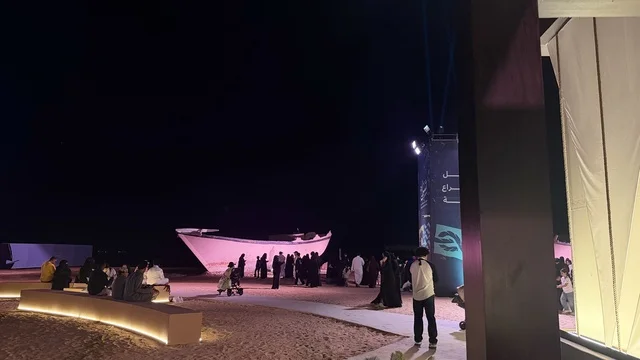 A white boat model, displays of traditional shipbuilding stages and the tools and materials used, the wooden ships festival on the Al-Hamra beach in Jeddah, Saudi Arabia from January 12 to 16, 2026, maritime heritage, interactive activities, and cultural performances.