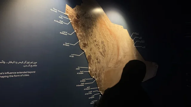 Exhibition display sign featuring a map of the Kingdom, presentations of the stages of traditional shipbuilding and the tools and materials used, Wooden Ships Festival on the Al-Hamra Beach in Jeddah, Saudi Arabia from January 12 to 16, 2026, maritime heritage, interactive activities, and cultural performances.