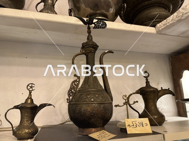 Heritage utensils at the Al-Falwah and Al-Jawhara Museum in the Al-Nuzha neighborhood of Dammam, Eastern Province, Kingdom of Saudi Arabia, on February 21, 2018, a distinctive educational and tourist destination, Saudi heritage, classic cars, a heritage and cultural landmark showcasing the history of traditional clothing and jewelry, documentation of handicrafts and Saudi identity, Islamic art.