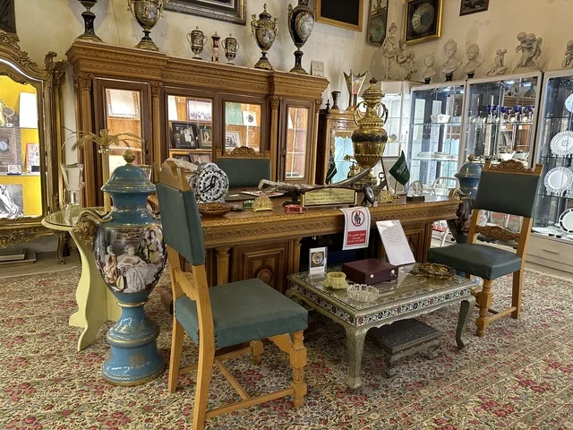 A royal heritage office at the Al-Falwah and Al-Jawhara Museum in the Al-Nuzha neighborhood of Dammam, Eastern Province, Saudi Arabia, on February 21, 2018, a distinctive educational and tourist destination, Saudi heritage, classic cars, a heritage and cultural landmark showcasing the history of traditional clothing and jewelry, documentation of handicrafts and Saudi identity, Islamic art.