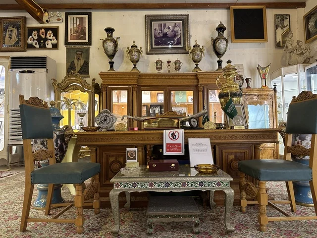 A royal heritage office at the Al-Falwah and Al-Jawhara Museum in the Al-Nuzha neighborhood of Dammam, Eastern Province, Saudi Arabia, on February 21, 2018, a distinctive educational and tourist destination, Saudi heritage, classic cars, a heritage and cultural landmark showcasing the history of traditional clothing and jewelry, documentation of handicrafts and Saudi identity, Islamic art.