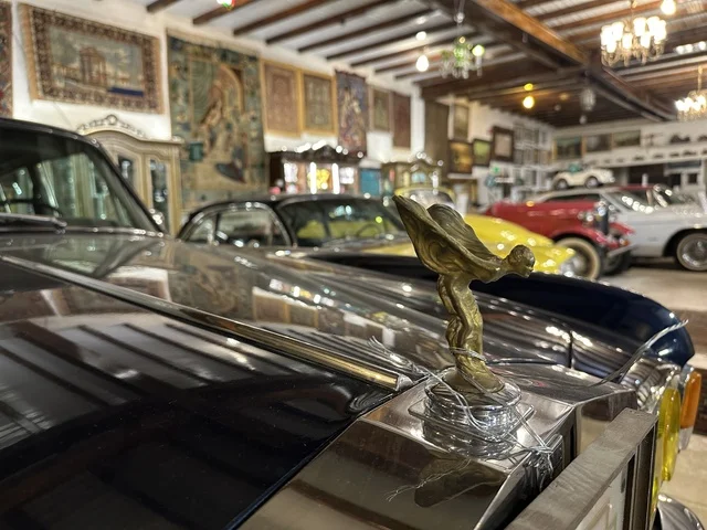 Classic vintage cars at the Al-Falwah and Al-Jawhara Museum in the Al-Nuzha neighborhood of Dammam, Eastern Province, Saudi Arabia, on February 21, 2018, a distinctive educational and tourist destination, documenting handicrafts and Saudi identity, a heritage and cultural landmark showcasing the history of traditional clothing and jewelry, Saudi heritage, Islamic art.