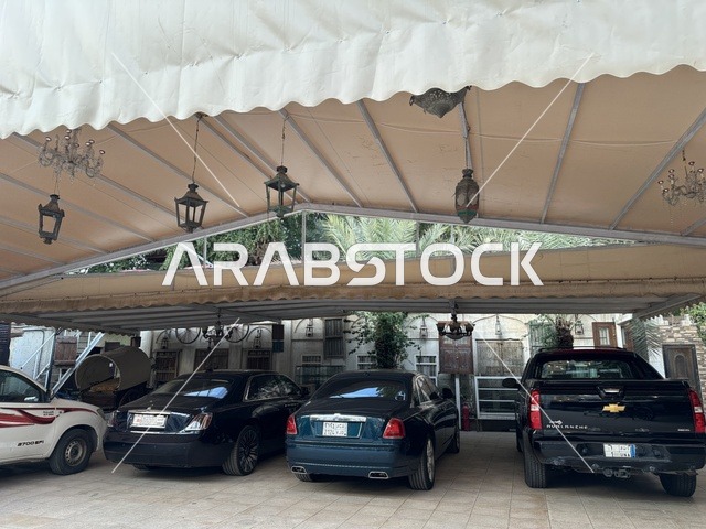 Parking in the outdoor parking lot of the Al-Falwah and Al-Jawhara Museum in the Al-Nazhah neighborhood of Dammam, Eastern Province, Saudi Arabia, on February 21, 2018, is a distinctive educational and tourist destination, showcasing Saudi heritage, documenting handicrafts and Saudi identity, a heritage and cultural landmark displaying the history of traditional clothing and jewelry, Islamic art.