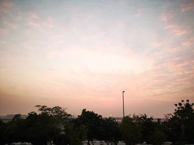 The clouds and skies at sunset, the coastal waterfront in the city of Dubai, the landscapes at Al Mamzar Beach, famous landmarks in the United Arab Emirates, a tourist destination to attract and draw in tourists.