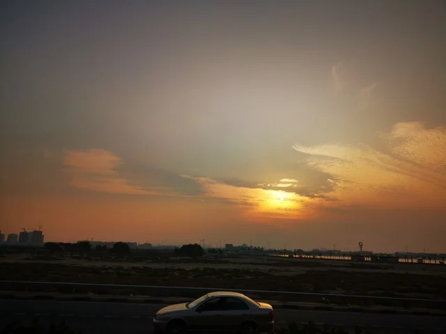 Famous landmarks in the United Arab Emirates, a tourist destination to attract and draw in tourists, the coastal waterfront in the city of Dubai, the clouds and skies at sunset, the natural scenery at Al Mamzar Beach.