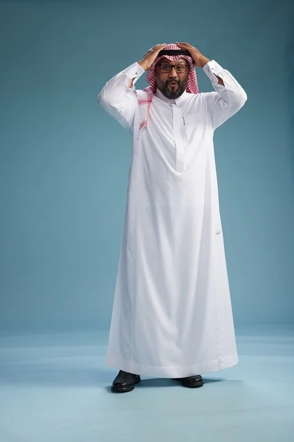 A portrait of an Arab Saudi Gulf man wearing a white thobe and a shemagh, with various gestures and movements, full body, blue background.