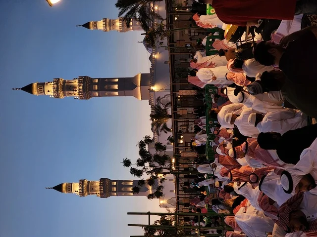The landmarks and sacred religious places in the Kingdom of Saudi Arabia gather Muslims to perform the Eid prayer, observe the rituals of Islamic holidays, the outdoor area of the Quba Mosque in Medina, worship and drawing closer to God, wearing new clothes and beautification, the architectural engineering art and Islamic decoration of minarets and domes.