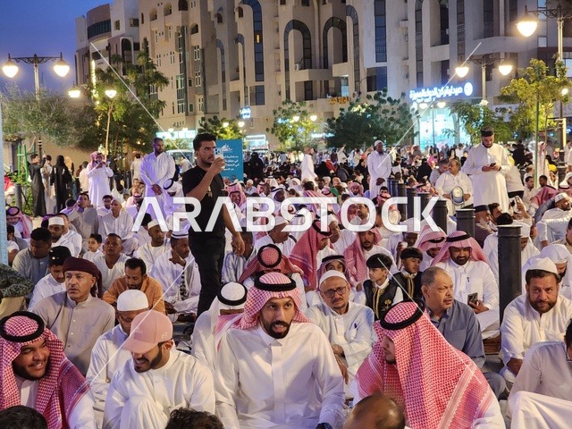 The landmarks and sacred religious places in the Kingdom of Saudi Arabia gather Muslims to perform the Eid prayer, observe the rituals of Islamic holidays, the outdoor area of the Quba Mosque in Medina, worship and drawing closer to God, wearing new clothes and beautification, the architectural engineering art and Islamic decoration of minarets and domes.