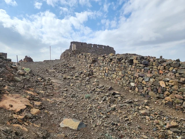 The seven ancient archaeological mosques at the top of the mountain during the day, the architecture in the old style, Islamic and religious sacred places and areas in the Kingdom of Saudi Arabia, the Trench Mosque on Mount Sal' in Medina.