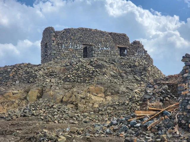 The seven ancient archaeological mosques at the top of the mountain during the day, the architecture in the old style, Islamic and religious sacred places and areas in the Kingdom of Saudi Arabia, the Trench Mosque on Mount Sal' in Medina.