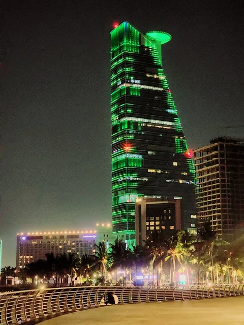 Events and celebrations of the 92nd Saudi National Day, the Kingdom Tower in Riyadh, Saudi Arabia, illuminated at night in green, famous landmarks of Riyadh, tourism in Saudi Arabia.