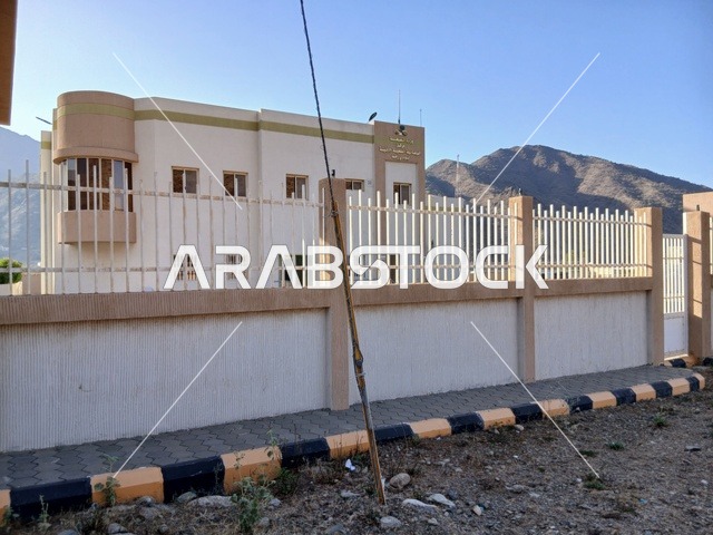 The primary healthcare center in the Al-Baha region in the village of Dhai Al-Ain, an archaeological site in the south of the Kingdom of Saudi Arabia, is surrounded by famous historical tourist attractions, trees, and green plants on the hills and mountain peaks.