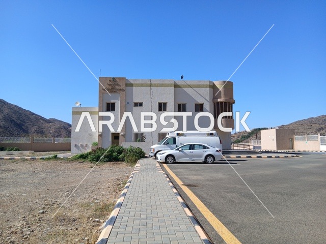 The primary healthcare center in the Al-Baha region in the village of Dhai Al-Ain, an archaeological site in the south of the Kingdom of Saudi Arabia, is surrounded by famous historical tourist attractions, trees, and green plants on the highlands and mountain peaks.