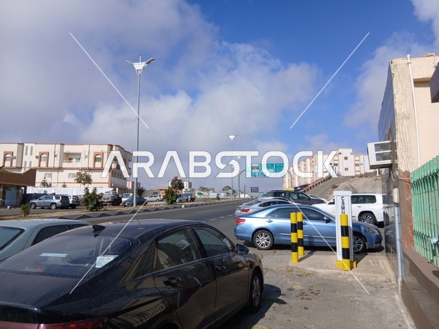The road to King Fahd Hospital in Al-Baha, the parking lot for medical centers in the mountainous area, health centers, hospitals, and patient care facilities, in the Kingdom of Saudi Arabia, preparing and equipping cities in the mountains, peaks, and rocky elevations.