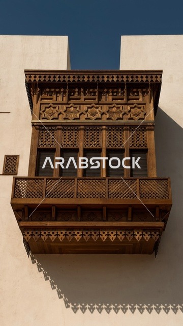 The historical buildings in the historic district of Jeddah in the Kingdom of Saudi Arabia, the alleys of the historic district in Jeddah, ancient Arab architectural design, archaeological buildings, historical landmarks in Jeddah, tourism in Saudi Arabia.