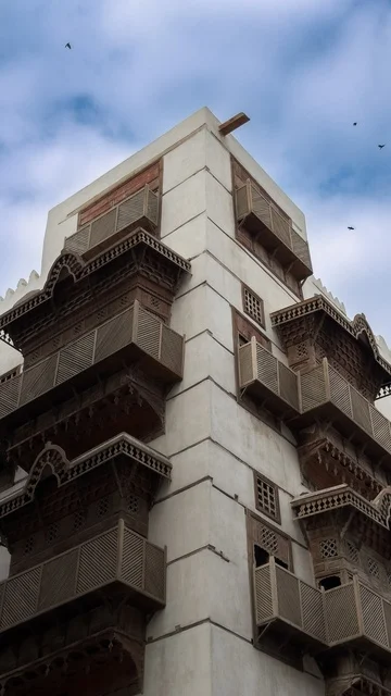 The historical buildings in the historic district of Jeddah in the Kingdom of Saudi Arabia, the alleys of the historic district in Jeddah, ancient Arab architectural design, archaeological buildings, historical landmarks in Jeddah, tourism in Saudi Arabia.