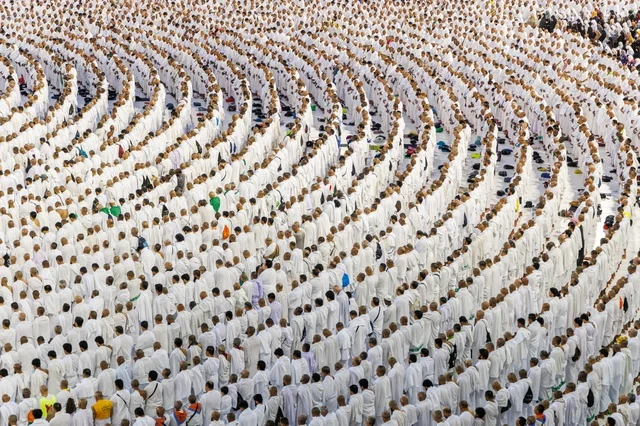 Places and sacred Islamic religious landmarks, performing the rituals of Hajj and Umrah, the Sacred Mosque in Mecca, Saudi Arabia, the circumambulation of the pilgrims around the Holy Kaaba in the courtyards of the Sacred Mosque, a destination for Muslims from all over the world, the concept of worship and drawing closer to God.