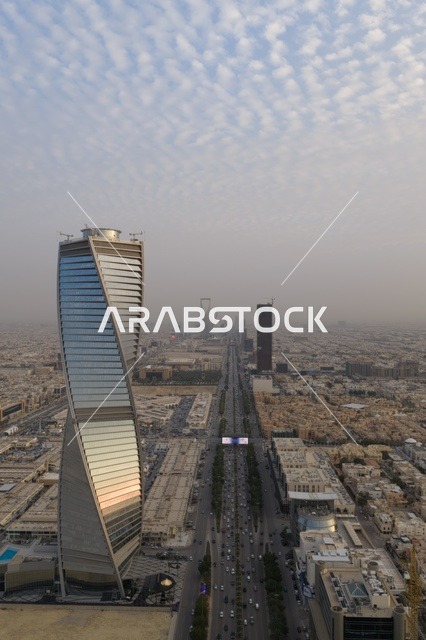 The architectural art of towers and skyscrapers in the capital, the illuminated towers of Riyadh at sunset, the development and urban progress of facilities in the Kingdom of Saudi Arabia, attractions that draw and attract tourists from all over the world, and architectural designs in a modern and advanced style.