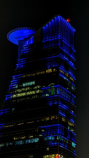 Jeddah Tower in the Kingdom of Saudi Arabia, the waterfront, green trees and plants, Jeddah Corniche, famous landmarks of Jeddah, tourism in Saudi Arabia.