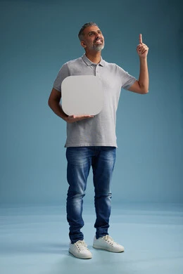 A Saudi Arabian Gulf Arab man wearing casual attire holding a white square board, a marketing advertisement display, with various movements and gestures, against a blue background, full body.