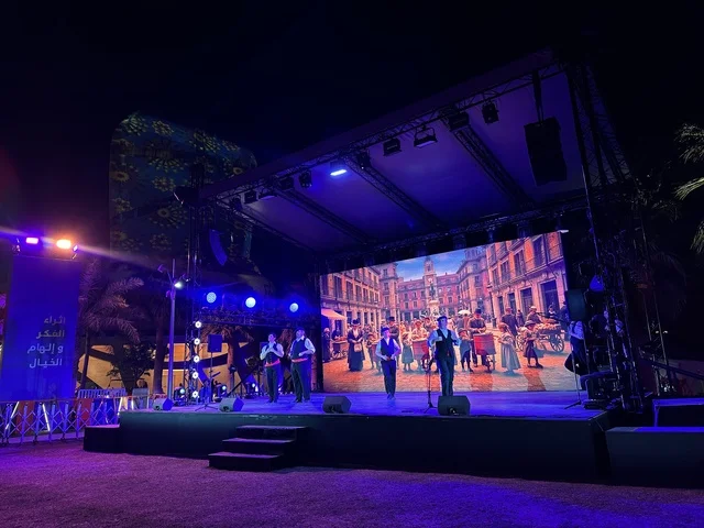 A group of dancers in traditional costumes at the Spain Street event at the King Abdulaziz Center for World Culture "Ithra" in Dhahran, Eastern Province, Saudi Arabia, on October 11, 2025, featuring live musical and artistic performances, interactive activities for families and children, flamenco dances, Spanish-themed restaurants and cafes, and a vibrant festive atmosphere.