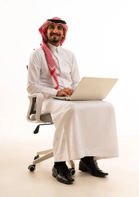 Saudi Businessman with Laptop on White Background