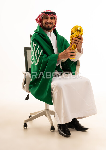 Saudi Man Holding World Cup Trophy With National Flag