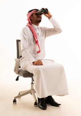 Saudi Man Using Binoculars on Office Chair Vision